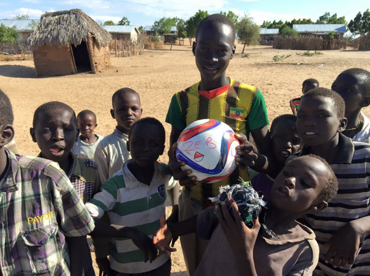 Zeb Montgomery battled leukaemia for 18 months and finally died in November 2015. He was 14. Zeb loved football and before he died he asked that as many footballs as possible be distributed to kids in the developing world in his name. 

Caroline Read writes: During our charity work in Africa we often see groups of children and teenagers playing football with a 'ball' made up of rags they have tied together. For most of them to own a football would be an impossible dream. In April and June 2016 we visited Malawi and Zambia and took footballs to personally distribute to kids in the communities where we work. The Zeb Foundation started us off with 40 and we were able to take more thanks to people donating through Communicate-ed's online Resources Shop.